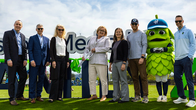 Representatives from Hillsboro Medical Center and the Hillsboro Hops cut ribbon for the Hillsboro Medical Center Family Zone.