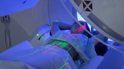 Woman receiving radiation treatment at cancer center