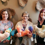 Three women with breast pillows