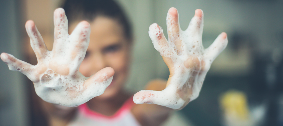 Kid with soapy hands